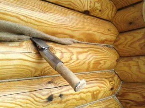 Зависят ли работы по конопатке сруба деревянного дома от температуры окружающей среды
